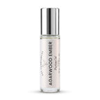 A 10 ml glass roll-on bottle of DST Fragrances Agarwood Ember Perfume Oil with a reflective silver cap, set against a plain white background.