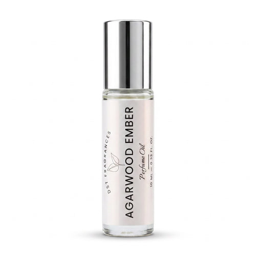A 10 ml glass roll-on bottle of DST Fragrances Agarwood Ember Perfume Oil with a reflective silver cap, set against a plain white background.
