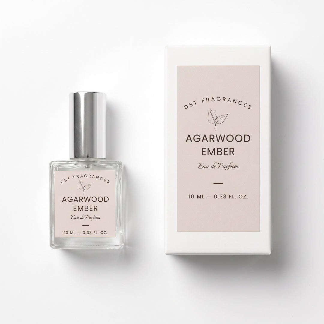 10ml bottle of Agarwood Ember eau de parfum and its box by DST Fragrances against a white background.