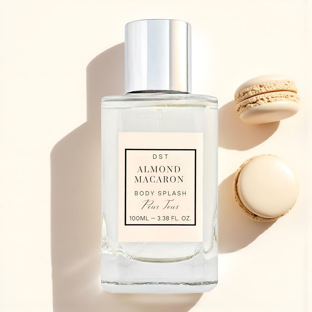 Body splash bottle labeled 'Almond Macaron' with macarons in the background