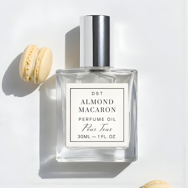 Perfume oil bottle labeled 'Almond Macaron' with a macaron on a light gray background