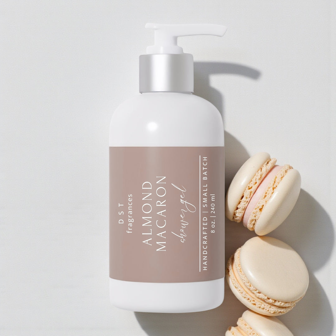 240ml bottle of Almond Macaron scented Shower Gel by DST Fragrances against a white background surrounded by almond french macarons.