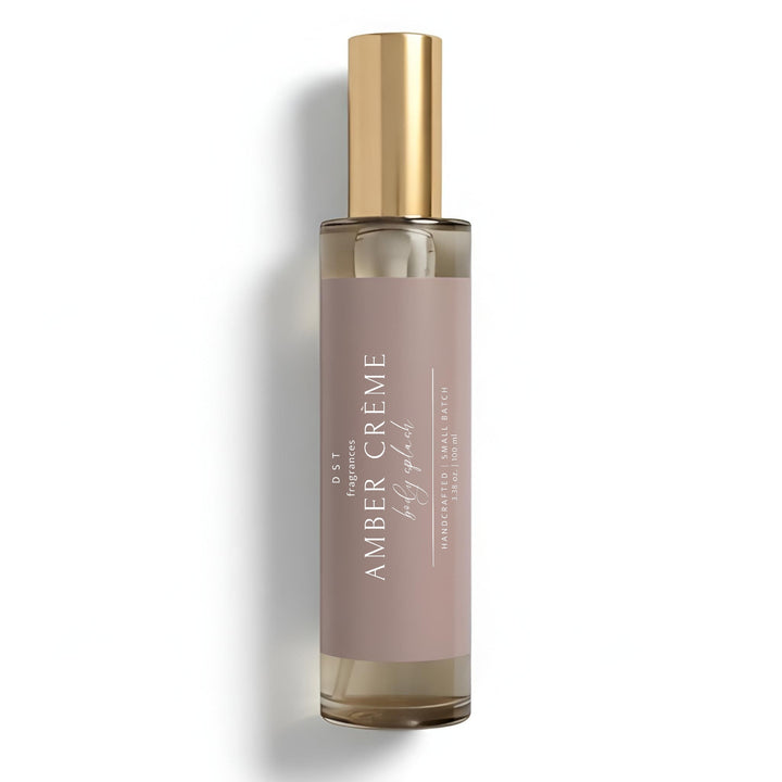 100ml bottle of Amber Crème scented Body Splash by DST Fragrances against a white background.