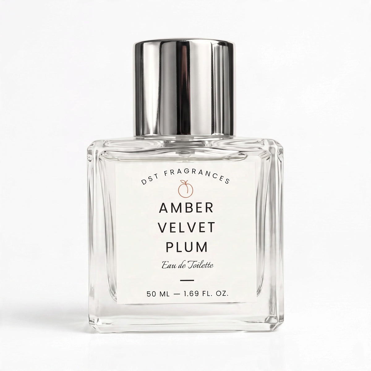 A 50 ml clear glass perfume bottle with a reflective silver cap, labeled 'AMBER VELVET PLUM' by DST FRAGRANCES, on a clean white background.