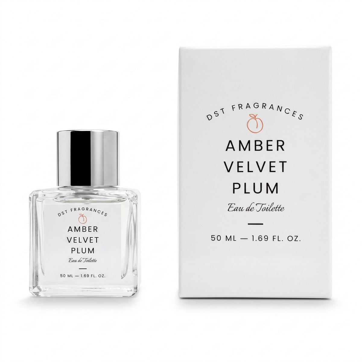 A clear glass perfume bottle with a reflective silver cap stands beside its white rectangular box. The label and box read DST FRAGRANCES, AMBER VELVET PLUM, Eau de Toilette, and 50 ML - 1.