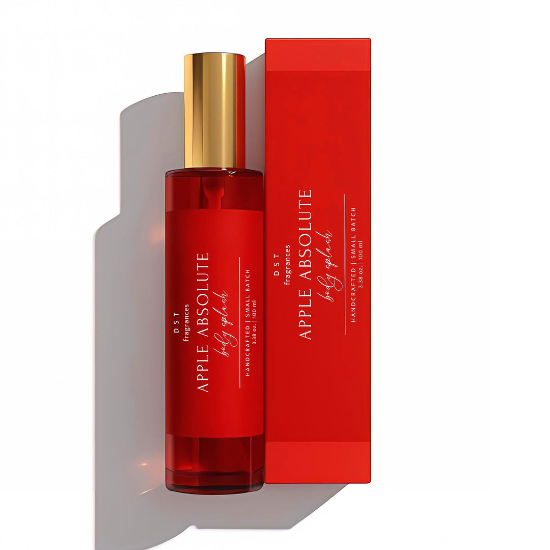 100ml bottle of Apple Absolute scented body Splash and its box by DST Fragrances against a white background.