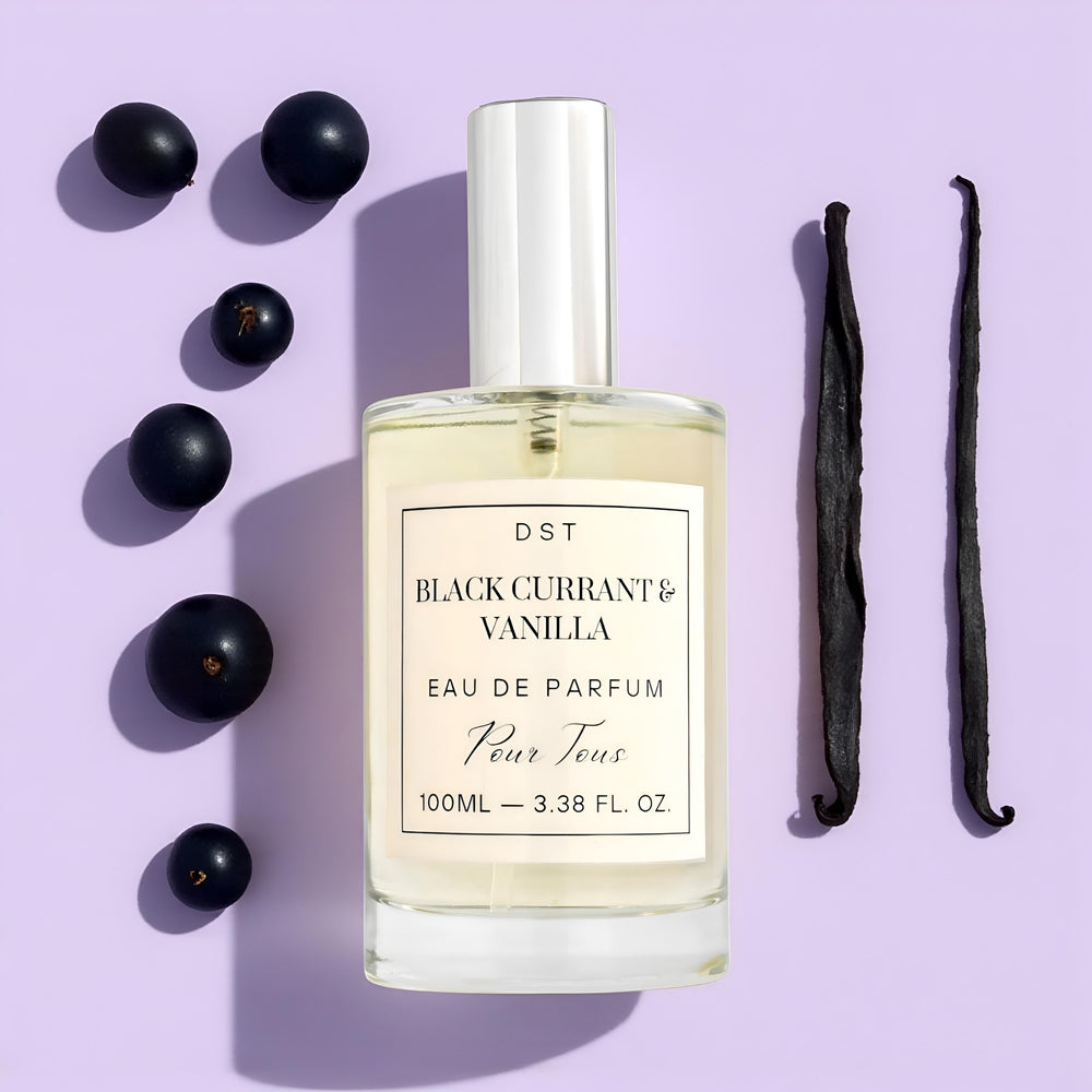 Black Currant Vanilla EDP surrounded by black currants and vanilla beans 