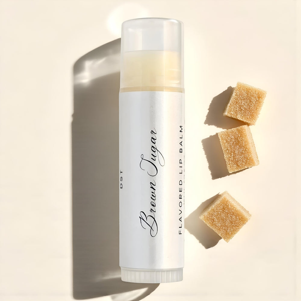 Brown Sugar flavored lip balm with brown sugar cubes on a beige background