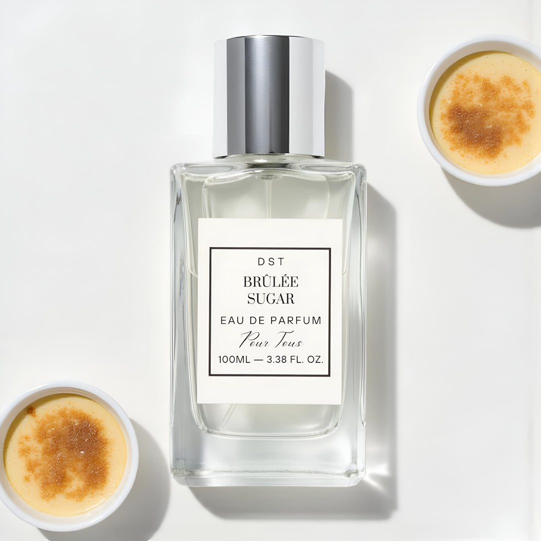 Perfume bottle labeled 'Brèlée Sugar' with two bowls of creme brèleé on a white background