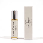 A 10 mL bottle of Café Vanille fragrance oil with a silver cap stands next to its matching cream-colored packaging box on a clean white background.