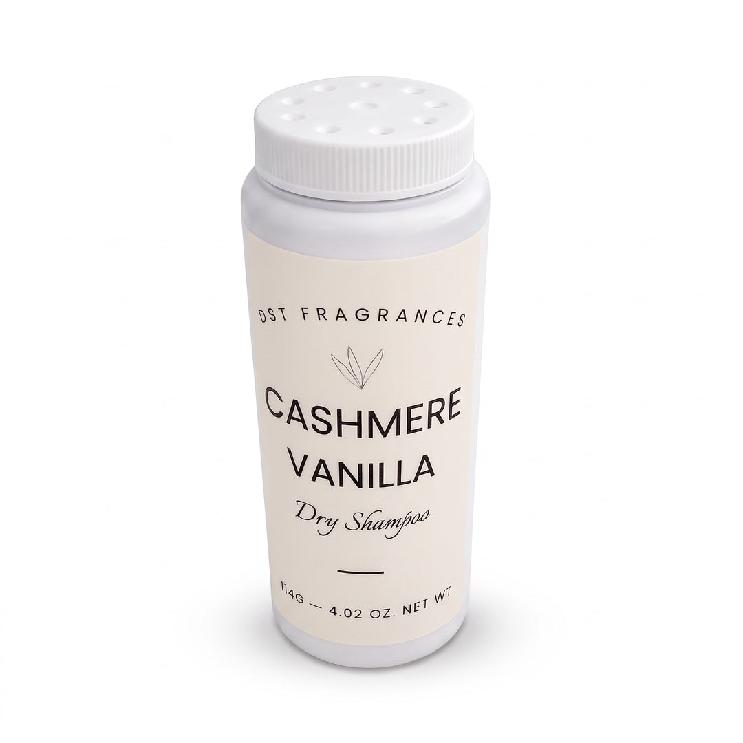 114g bottle of Cashmere Vanilla scented Dry Shampoo Powder by DST Fragrances against a white background. Photo shows dispenser holes in cap.