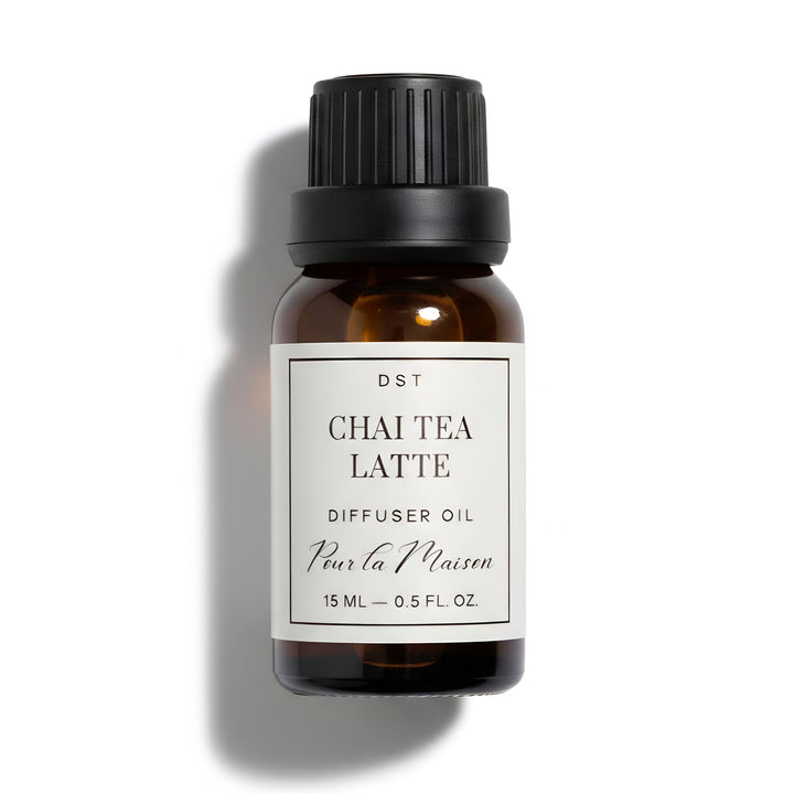 Bottle of Chai Tea Latte diffuser oil with a black cap on a white background
