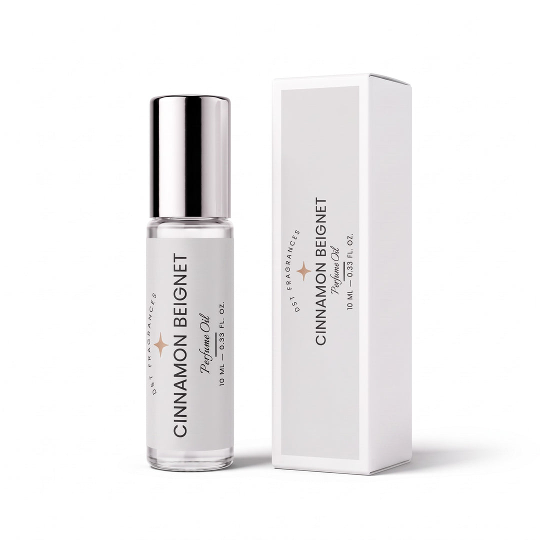10ml roll on bottle of Cinnamon Beignet Perfume Oil by DST Fragrances and the box it is packaged in.