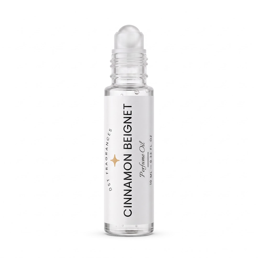 10ml roll-on bottle of Cinnamon Beignet Perfume Oil by DST Fragrances with the cap removed showing the rollerball dispenser mechanism