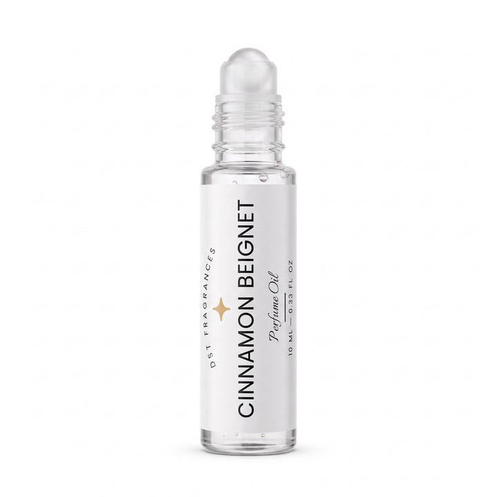 10ml roll-on bottle of Cinnamon Beignet Perfume Oil by DST Fragrances with the cap removed showing the rollerball dispenser mechanism