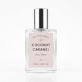 A 50 ml clear glass perfume bottle with a silver cap and a light pink label reading 'Coconut Caramel' by DST Fragrances, on a white background.