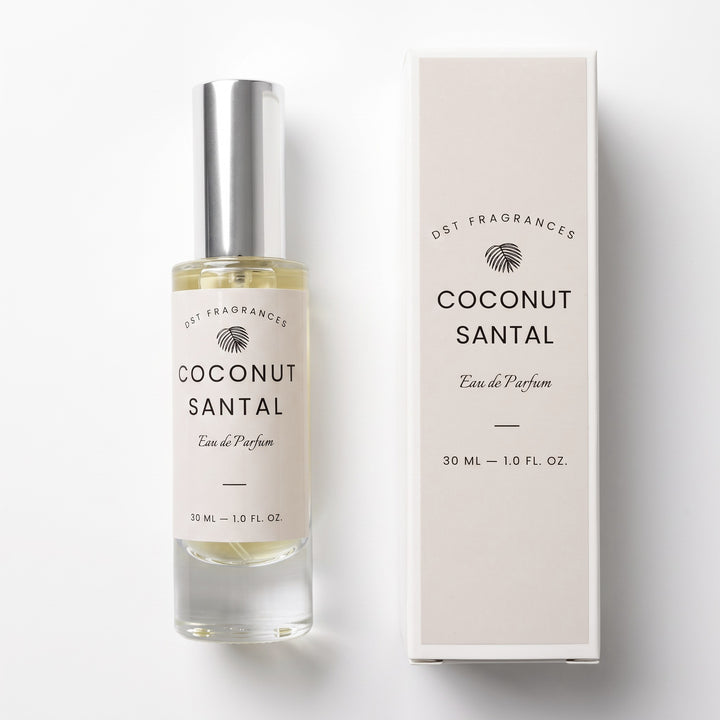 A bottle of Coconut Santal Eau de Parfum by DST Fragrances next to its matching cream-colored packaging box, set against a clean white background.