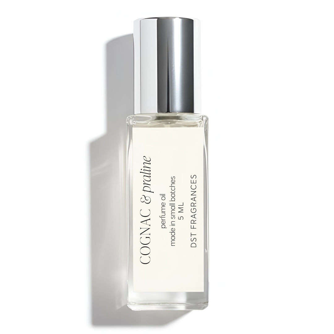 5ml roll on bottle of Cognac Praline scented Perfume Oil by DST Fragrances against a white background.