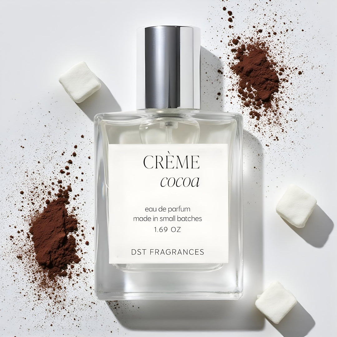 100ml bottle of Creme Cocoa Eau de Parfum by DST Fragrances against a white background with cocoa powder and white marshmallows.