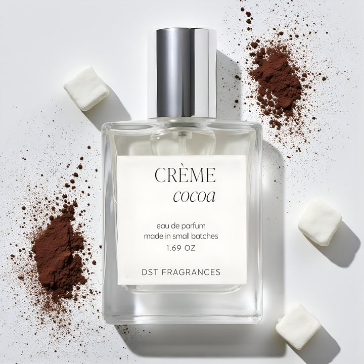 100ml bottle of Creme Cocoa Eau de Parfum by DST Fragrances against a white background with cocoa powder and white marshmallows.
