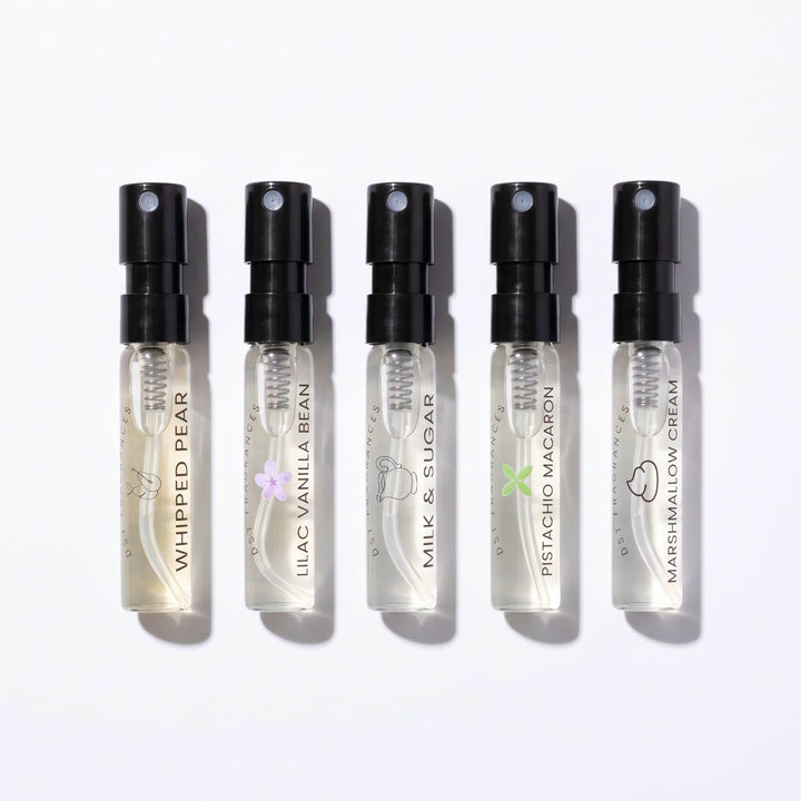 5 2ml Sample Vials of Eau de Parfum by DST Fragrances flat lay on a white background.