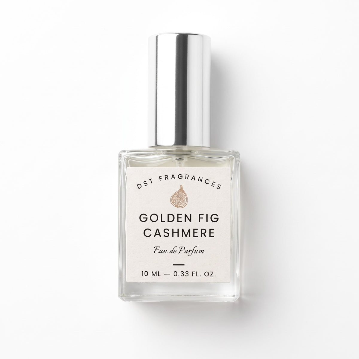 A 10 mL clear glass perfume bottle with a silver cap and a white label reading 'DST FRAGRANCES GOLDEN FIG CASHMERE Eau de Parfum'.