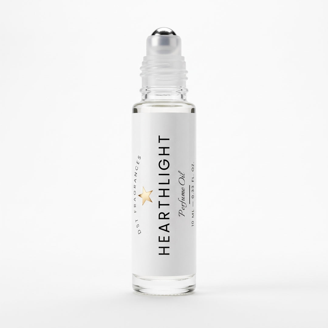 A clear glass roll-on bottle of Hearthlight Perfume Oil with a white label and silver cap, shown on a clean white background.