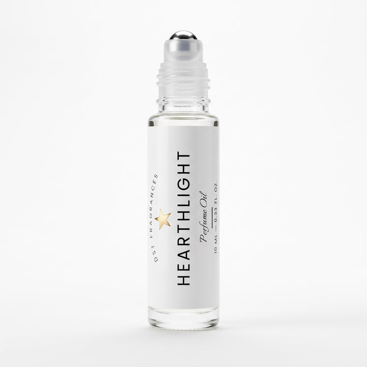 A clear glass roll-on bottle of Hearthlight Perfume Oil with a white label and silver cap, shown on a clean white background.