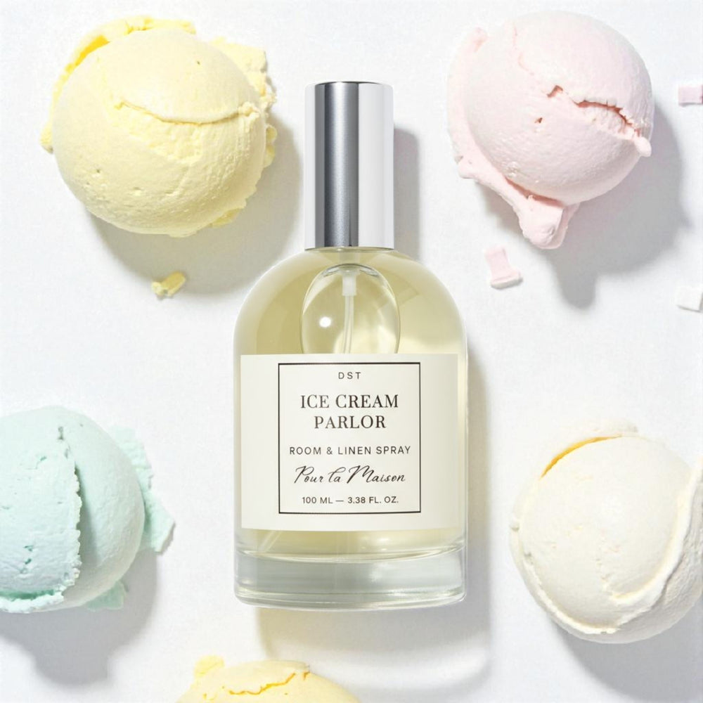 Room and linen spray bottle labeled 'Ice Cream Parlor' with scoops of pastel colored ice cream on a light background