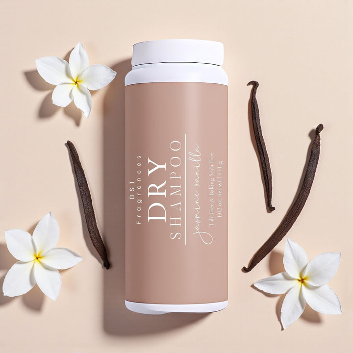 Jasmine Vanilla dry shampoo container with vanilla beans and flowers on a light background