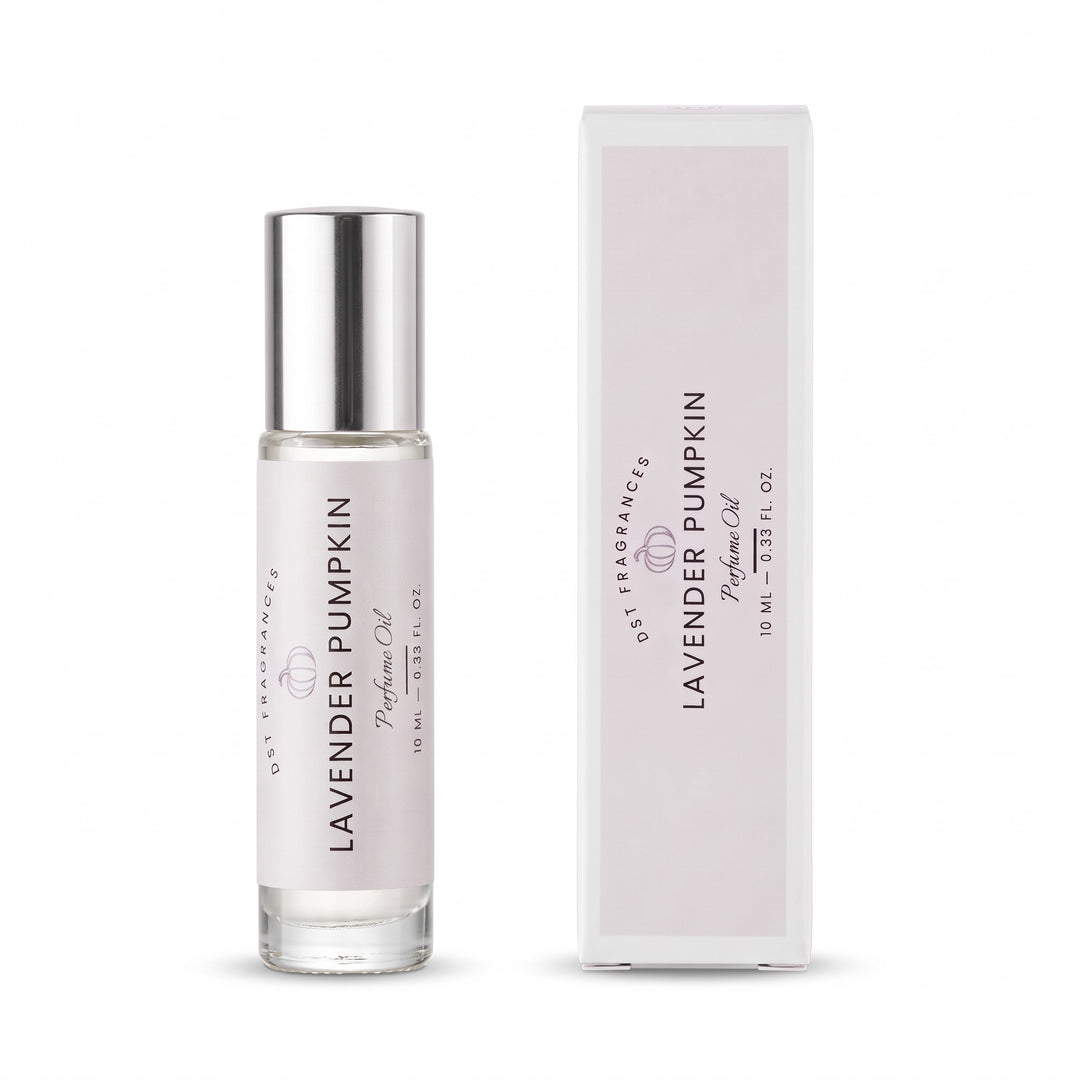 A 10ml roll-on bottle of Lavender Pumpkin perfume oil by DST Fragrances standing next to its box against a white background.