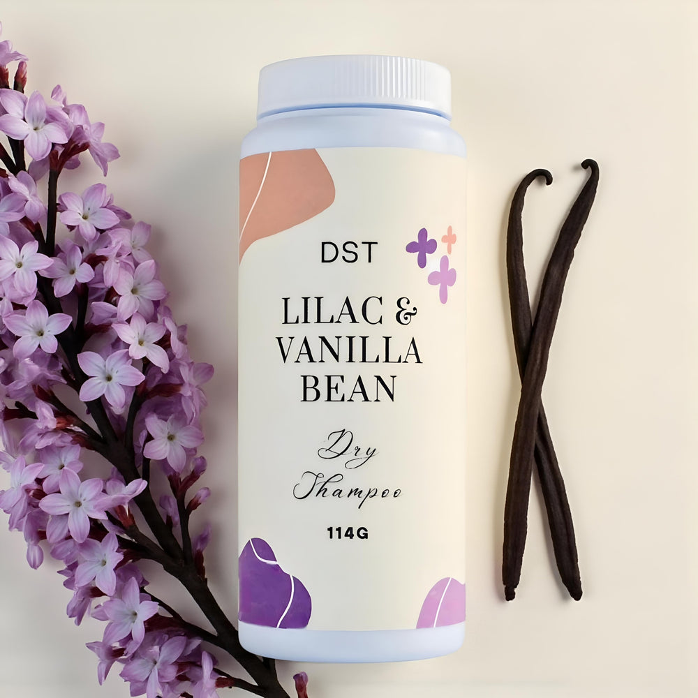 Shampoo bottle labeled 'Lilac & Vanilla Bean' with flowers and vanilla beans on a light background