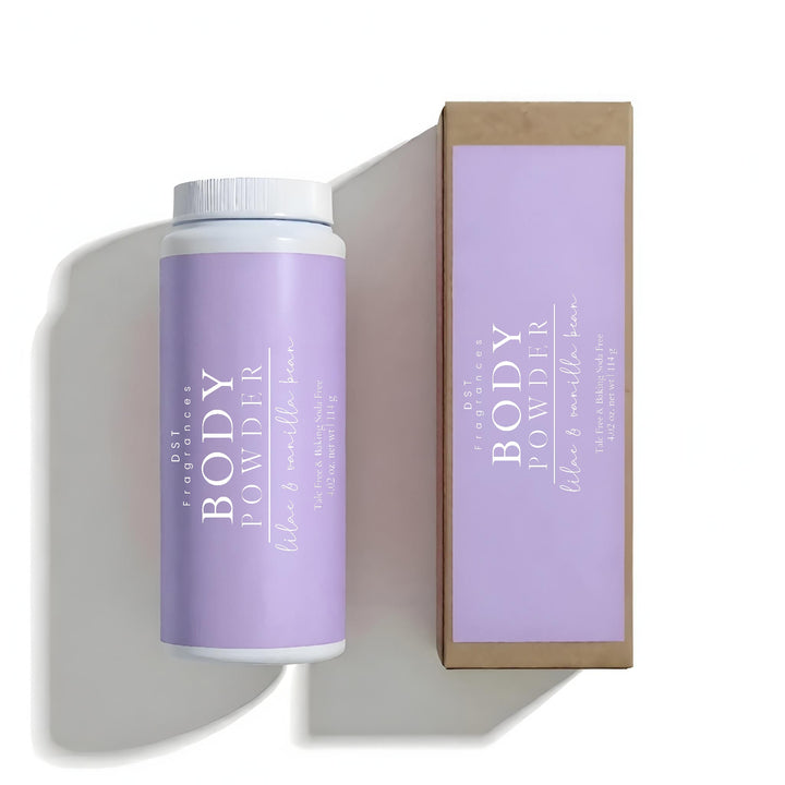 Body powder container with purple label and white cap, next to its packaging box on a white background.