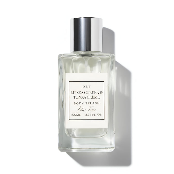 Clear bottle of Litsa Cuba & Tonka Creme body splash with silver cap on a white background