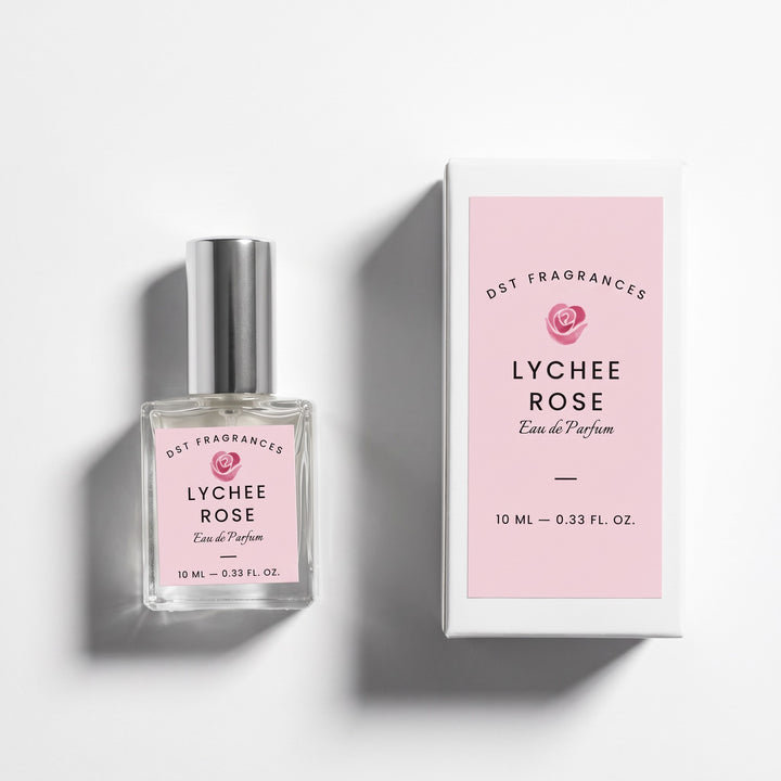 10ml bottle of Lychee Rose EDP and its box by DST Fragrances against a white background.