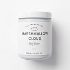 A white jar of DST Fragrances Marshmallow Cloud Body Butter, featuring a clean white label with black text and a small cloud icon, set against a plain white background.