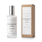 A bottle of DST Fragrances Marshmallow Cloud Body Splash next to its brown kraft paper packaging box, both featuring white labels with black text and a cloud graphic, on a clean white background.