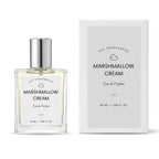 Marshmallow Cream Eau de Parfum by DST Fragrances, shown in a clear glass bottle with a silver cap next to its white packaging box.