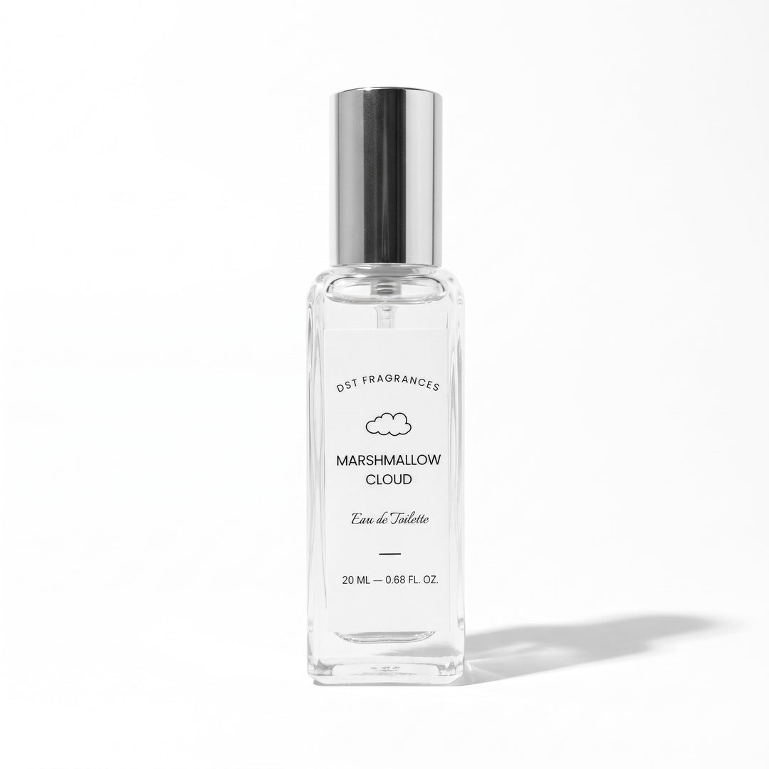 A clear glass perfume bottle with a reflective silver cap, labeled &