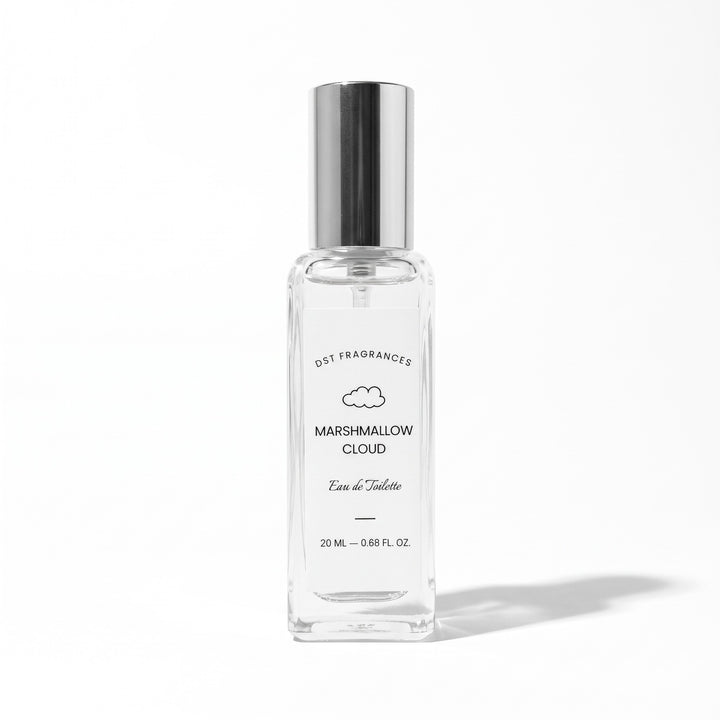 A clear glass perfume bottle with a reflective silver cap, labeled &