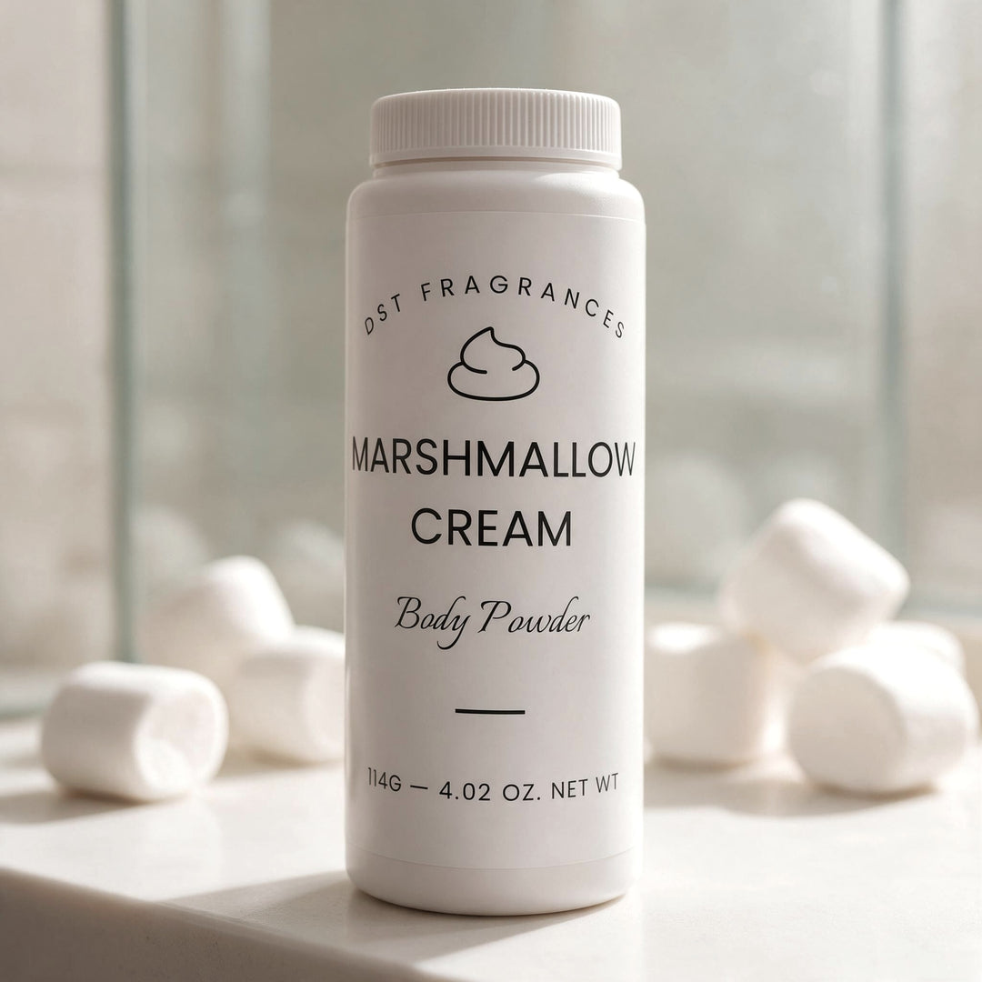 A white plastic bottle of DST Fragrances Marshmallow Cream Body Powder stands on a light stone surface with blurred marshmallows in the background.