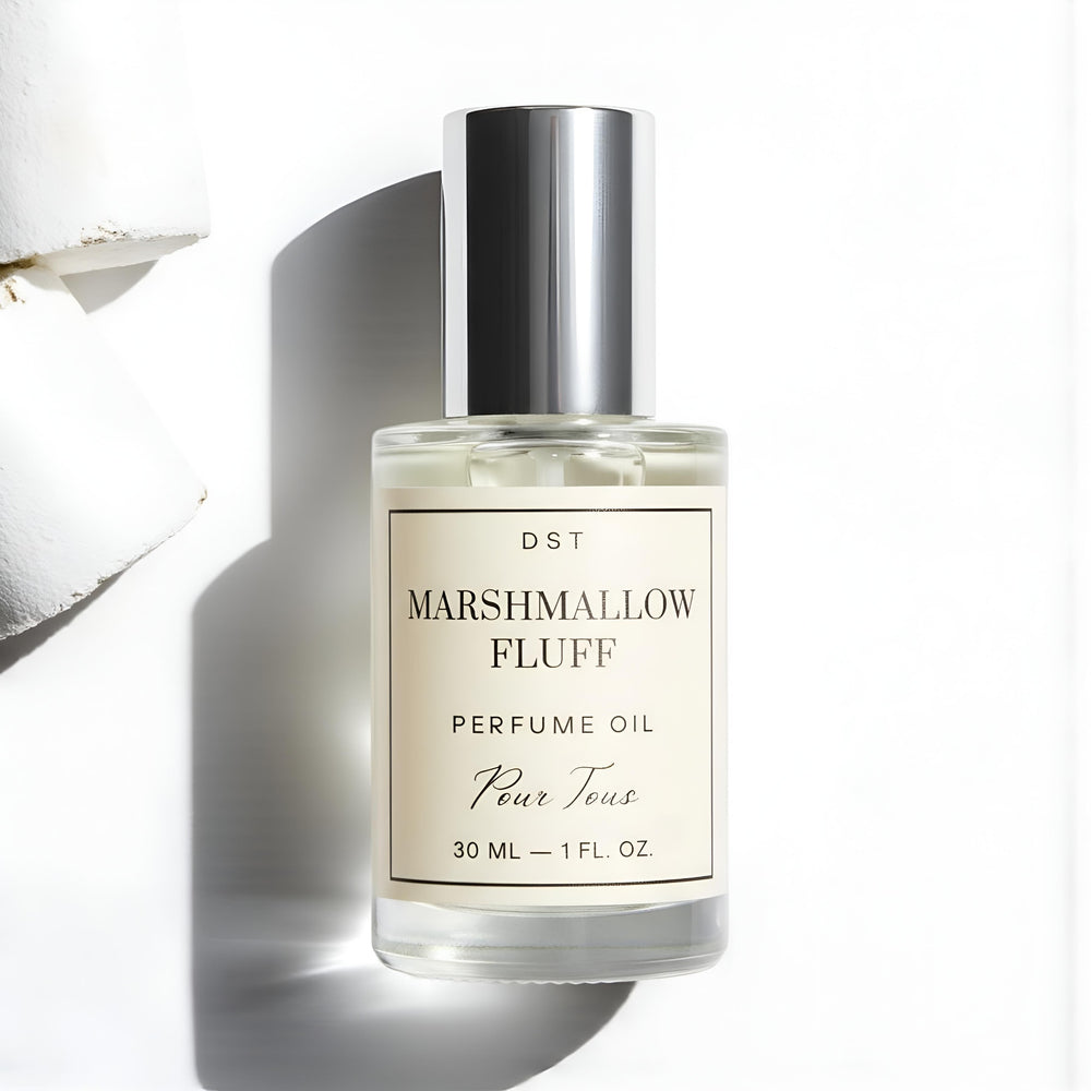 Marshmallow Fluff Perfume Oil on ivory backdrop with marshmallows 