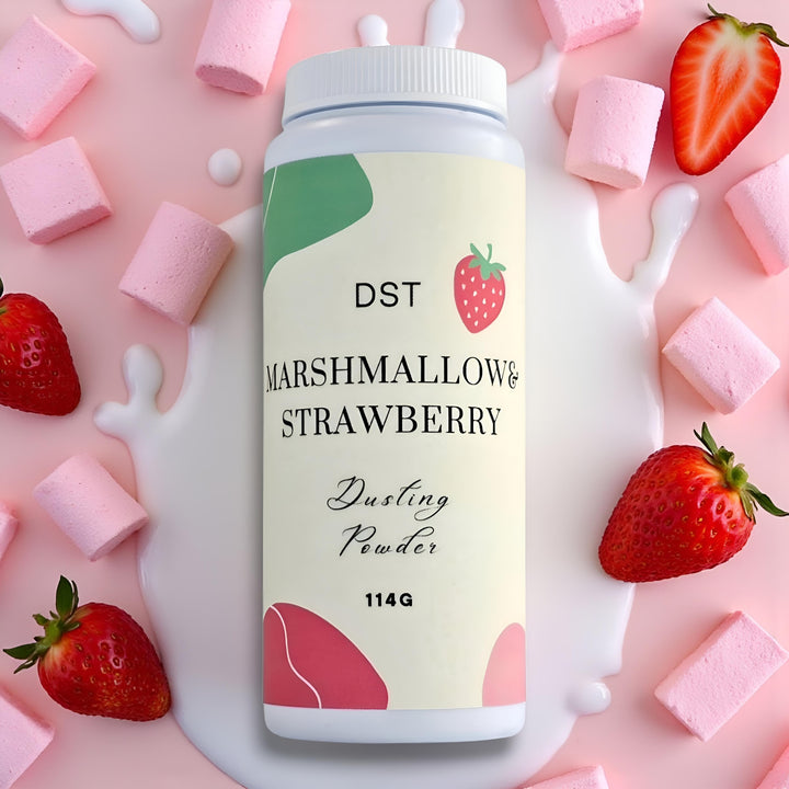 Bottle of DST Marshmallow & Strawberry Dusting Powder surrounded by strawberries and marshmallows on a pink background