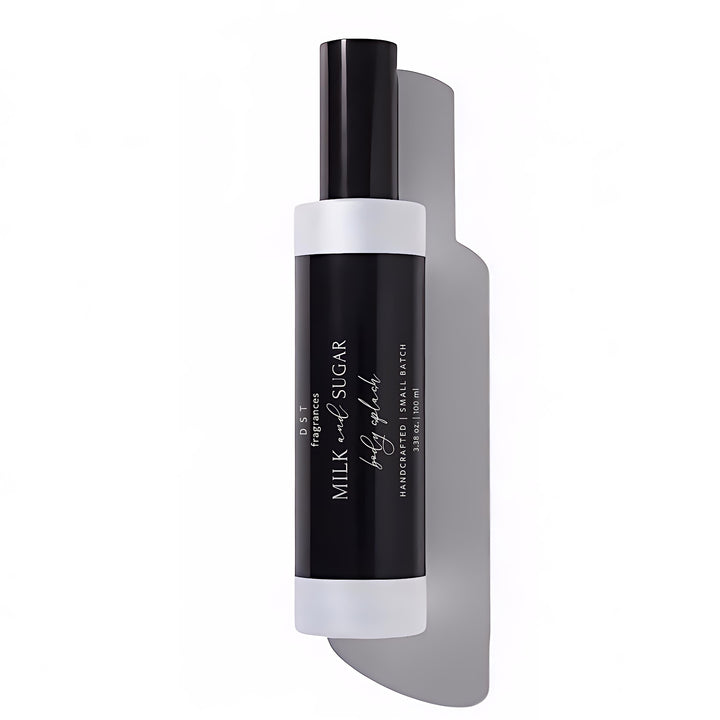 Black and white bottle of body splash with 'Milk & Sugar' branding on a white background