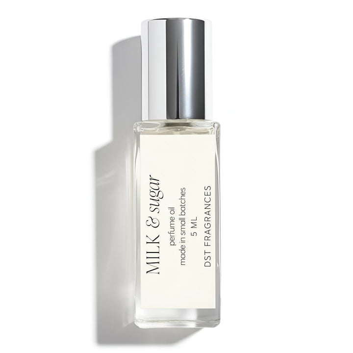 Perfume oil bottle labeled 'Milk & Sugar' on a white background