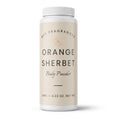 A white plastic bottle of DST Fragrances Orange Sherbet Body Powder with a cream-colored label, shown on a clean white background.