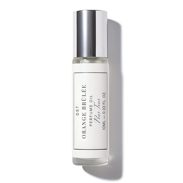 Perfume oil bottle labeled 'Orange Brélé' on a white background