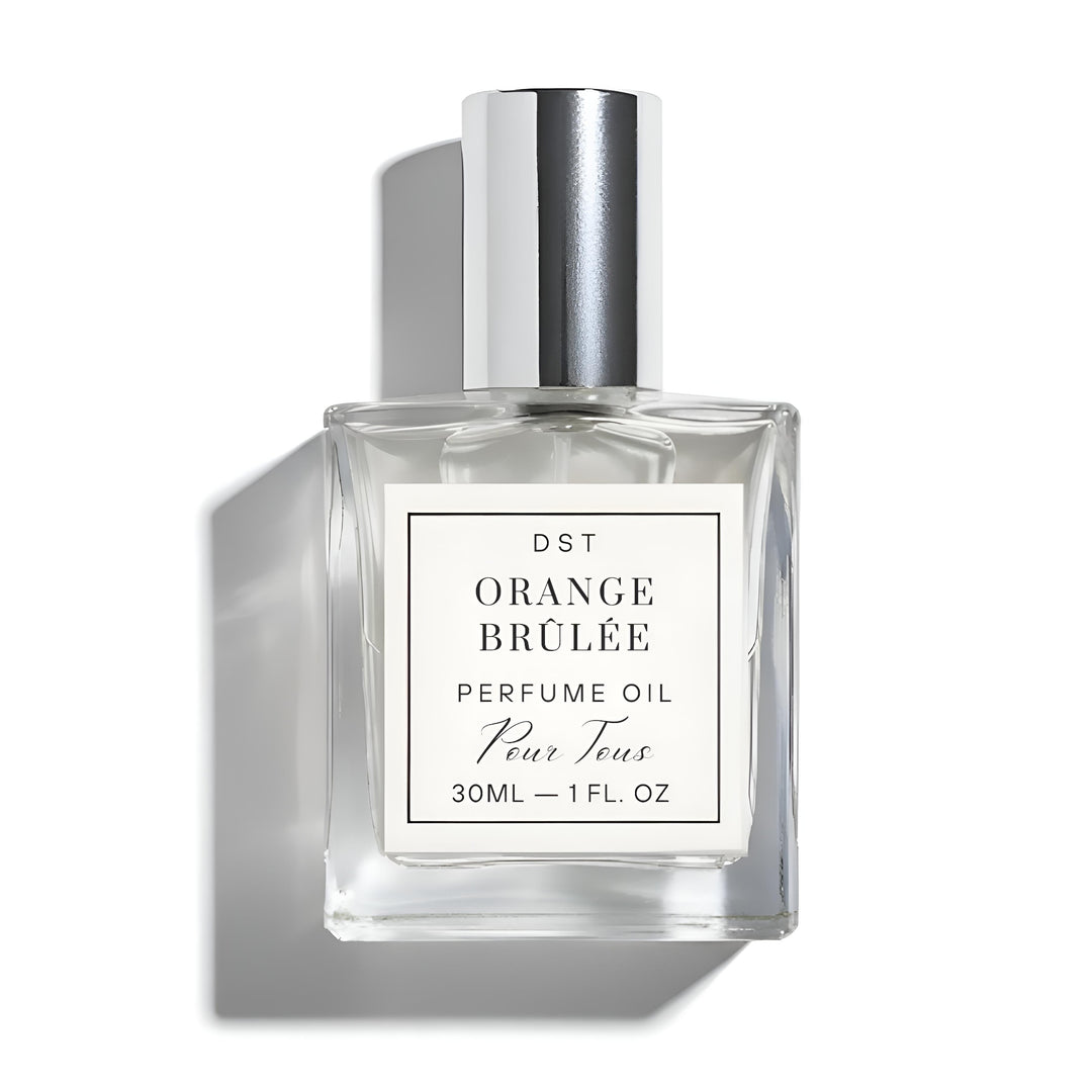 Perfume oil bottle labeled 'Orange Brèlé' on a white background