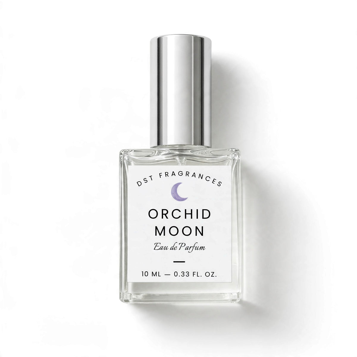 A 10 ml clear glass perfume bottle with a silver cap, featuring a white label with black text and a purple crescent moon logo. The label reads DST FRAGRANCES ORCHID MOON Eau de Parfum'.