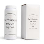 A white plastic bottle and matching white box for DST Fragrances Patchouli Moon Body Powder, shown on a clean white background.
